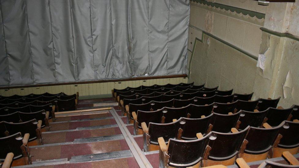 Cinema seating and covered screen