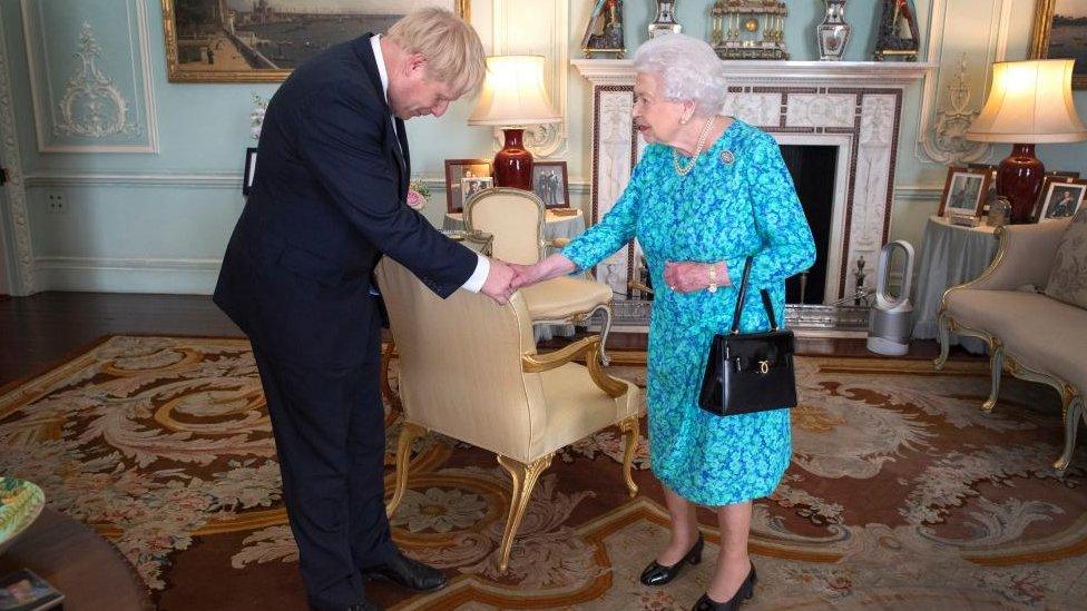 Queen Elizabeth II welcomes newly elected leader of the Conservative party Boris Johnson during an audience in Buckingham Palace, London