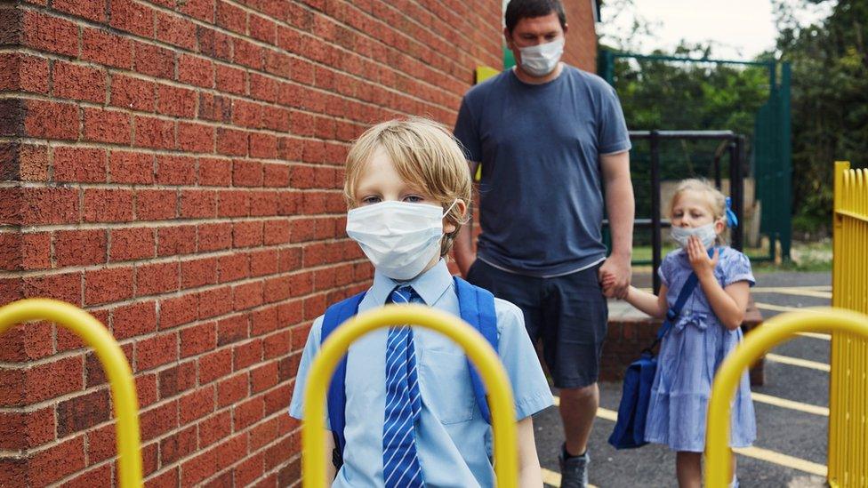 child in face mask