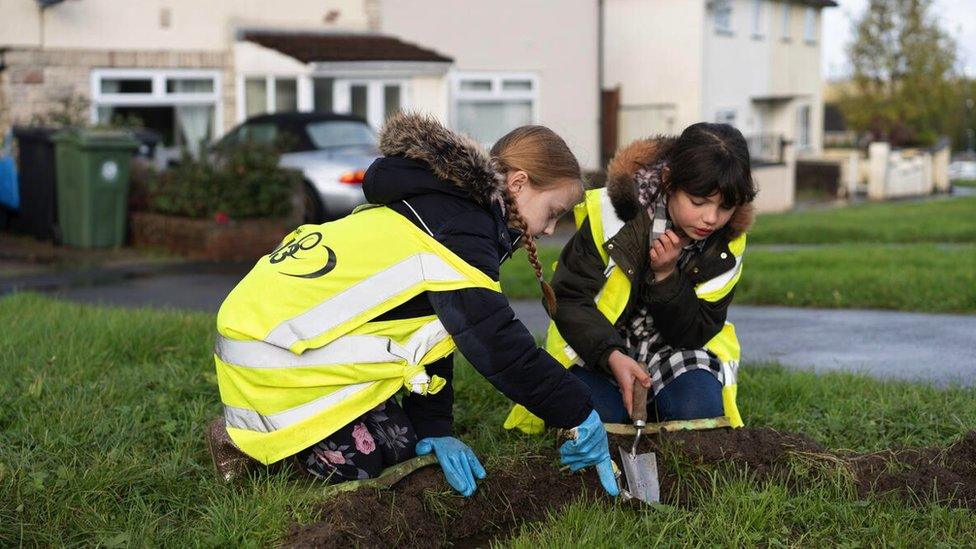 Image of children planting flowers