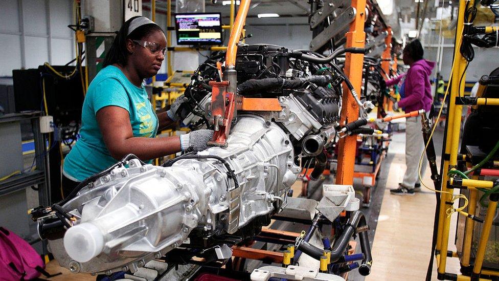 Workers at on a Chrysler assembly line at the Warren Truck Assembly Plant Sept 25, 2014 in Warren, Michigan