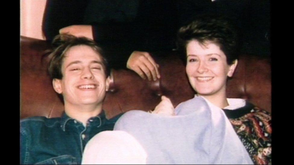 Joanna Parrish and Patrick Proctor sitting on a sofa