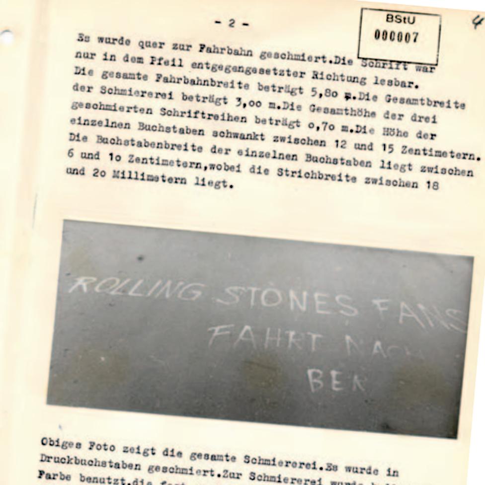 Chalk message on the road, photographed in Stasi report