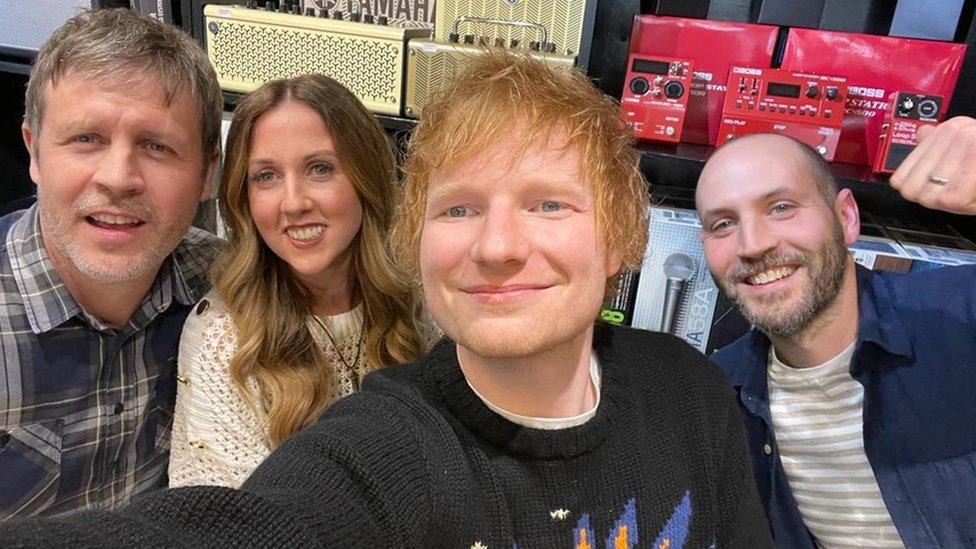 Ed Sheeran with members of the Fender family in Music World