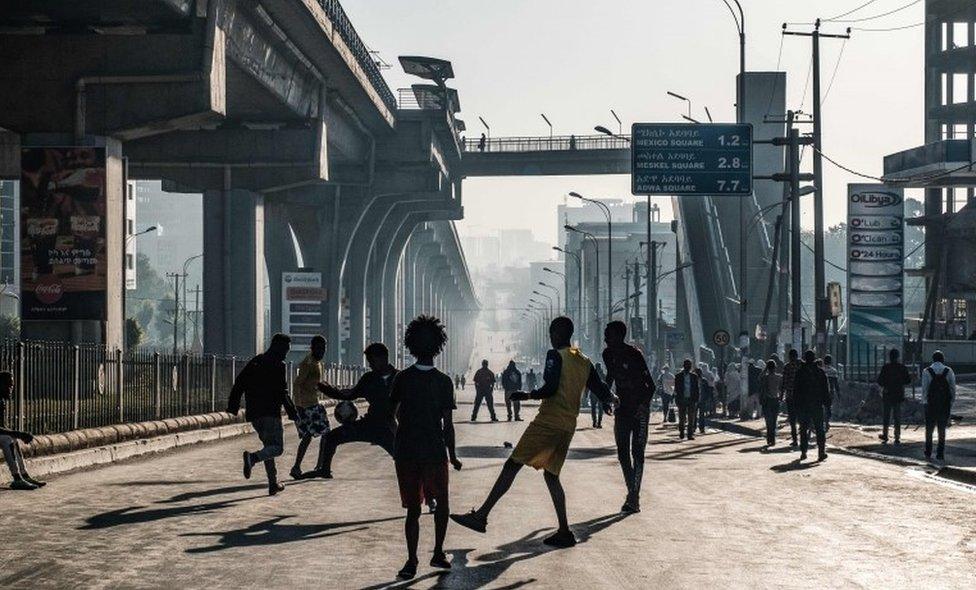 People play football in Addis Ababa on 3 February 2019 during the third Car Free Day