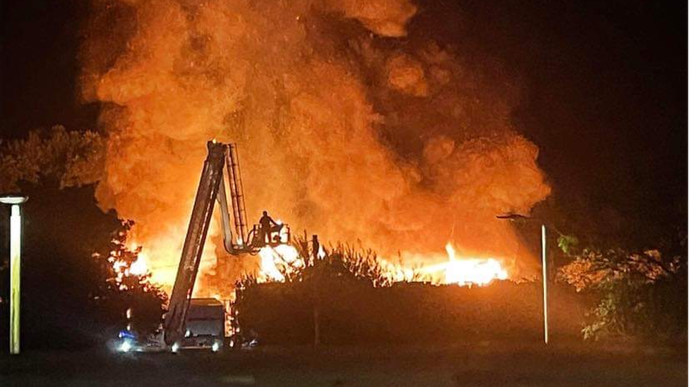 Fire being tackled from an aerial ladder