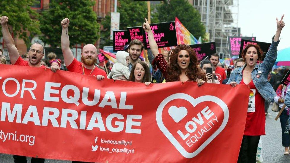 Gay rights campaigners take part in a march through Belfast on July 1, 2017 to protest against the ban on same-sex marriage. / AFP PHOTO / Paul FAITH (Photo credit should read PAUL FAITH/AFP/Getty Images)