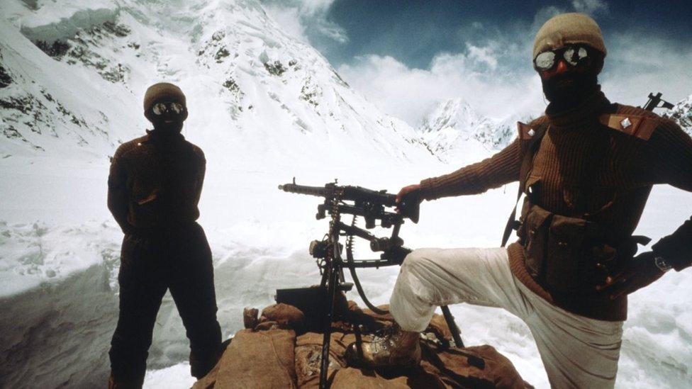 Pakistani soldiers stand June, 1989 in Kashmir near the Pakistan-India border