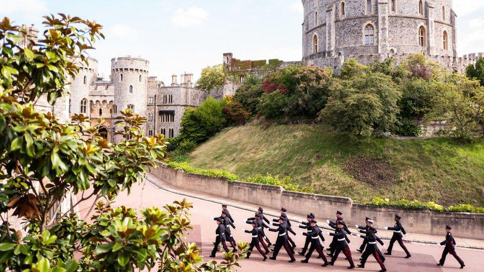 Armed Forces march past the Round Tower in Windsor Castle