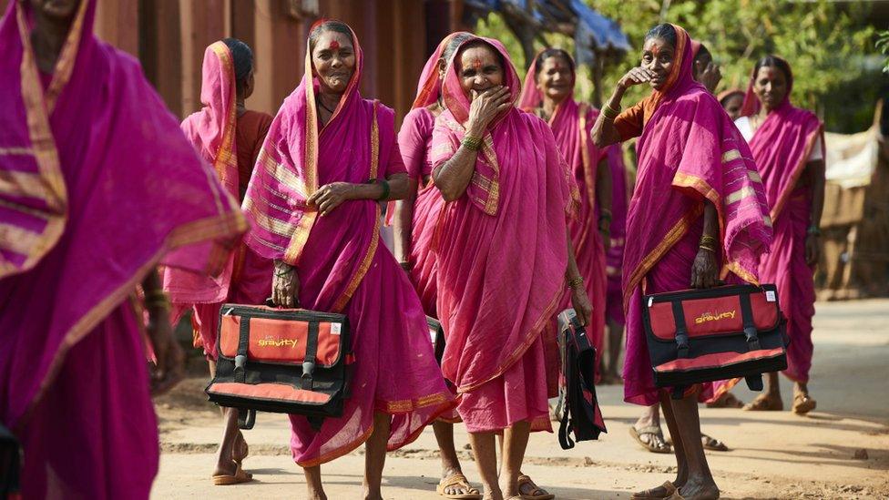 Women walk home from school