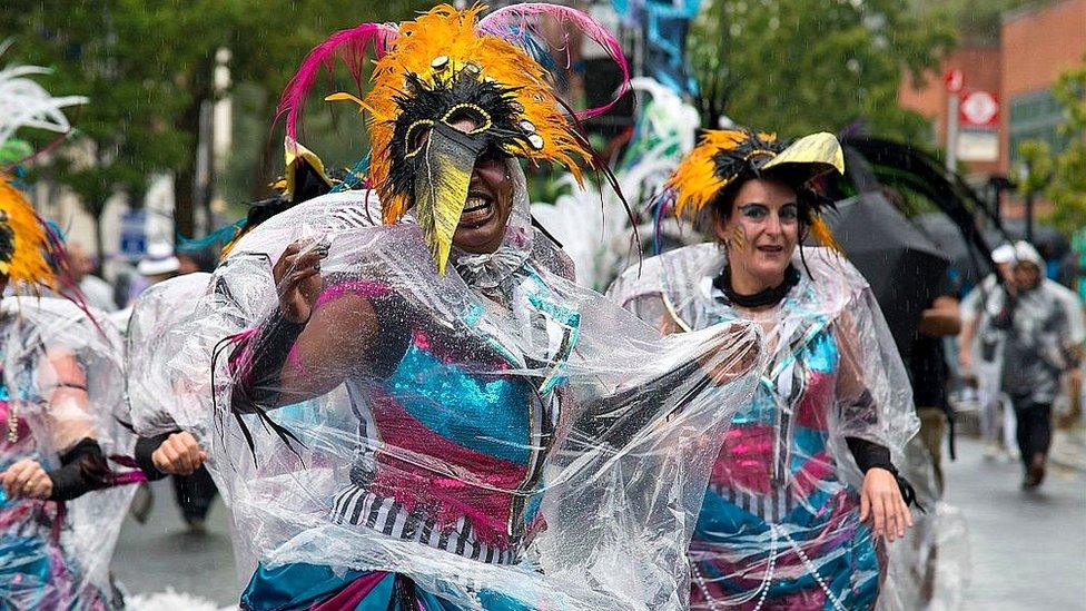 Performers in the rain in 2015