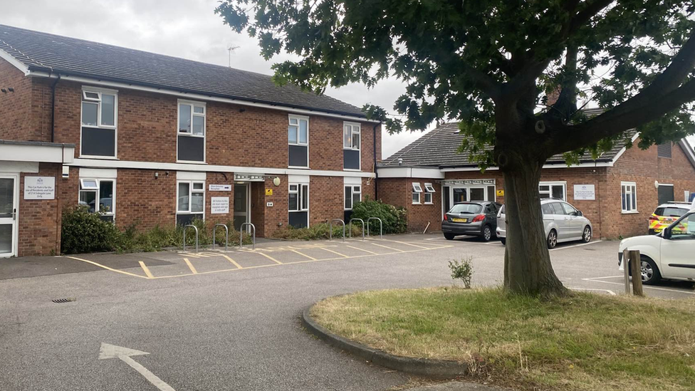 Police cars outside a temporary housing unit in Ipswich