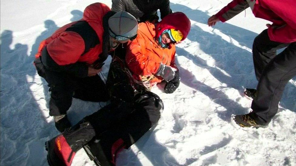 Alexander Gukov (centre) is being evacuated from Latok 1