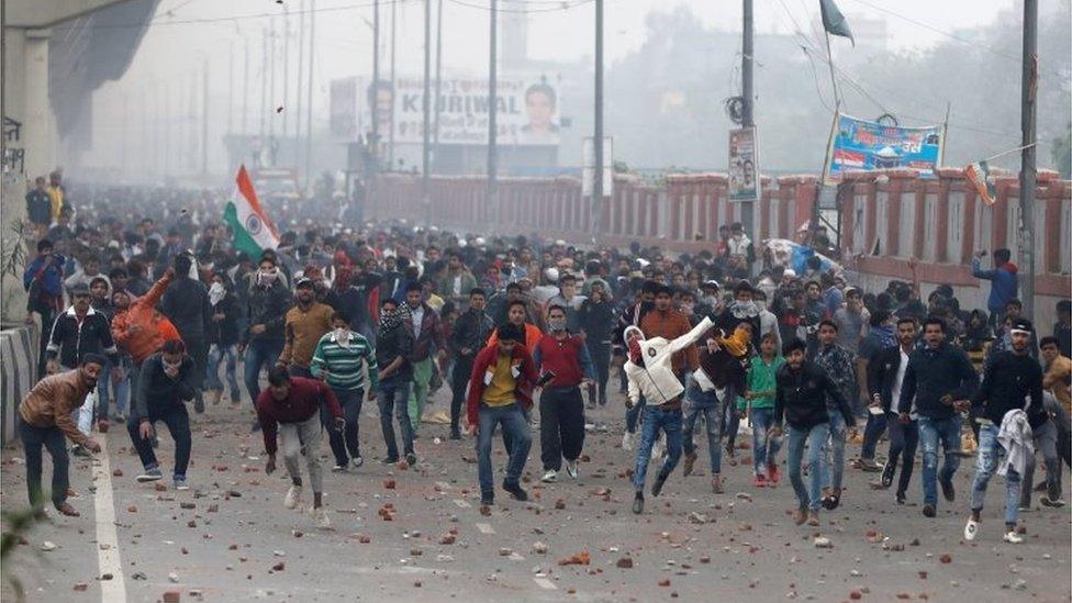 Demonstrators attend a protest against a new citizenship law in Seelampur, Delhi