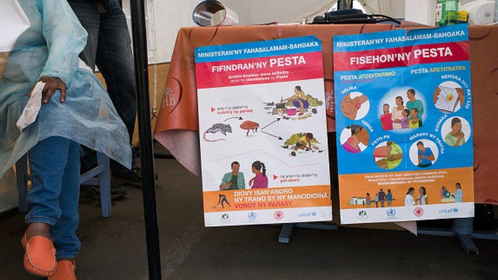 Doctors and nurses from the Ministry of Health and officers of the Malagasy Red Cross staff a healthcare checkpoint at the 'taxi-brousse' station of Ampasapito district in Antananarivo