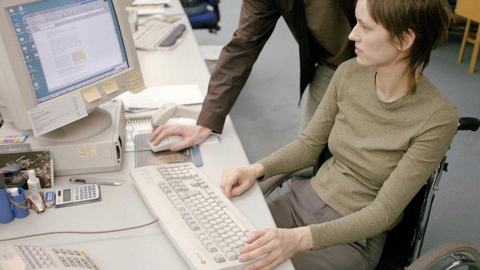 Disabled woman at work in an office