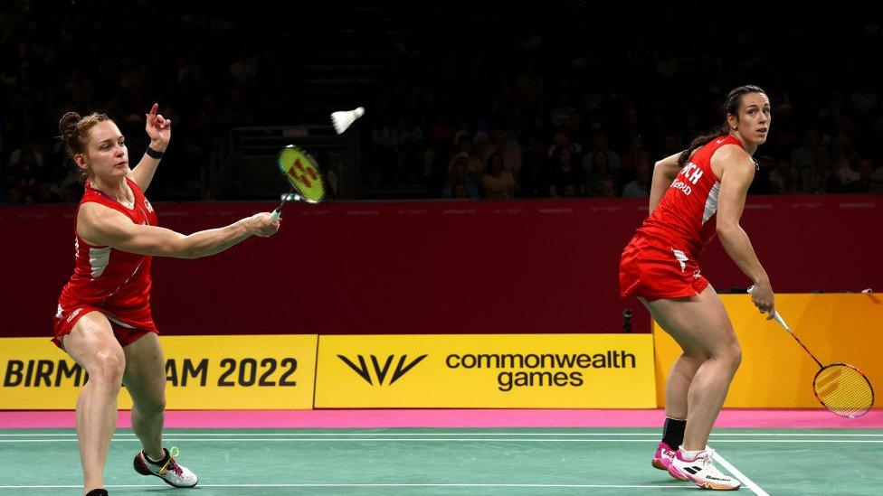 Chloe Birch and Lauren Smith of Team England compete against Koong Le Pearly Tan and Muralitharan Thinaah of Team Malaysia during the Badminton Women's Doubles - Gold Medal Match on day eleven of the Birmingham 2022 Commonwealth Games at NEC Arena