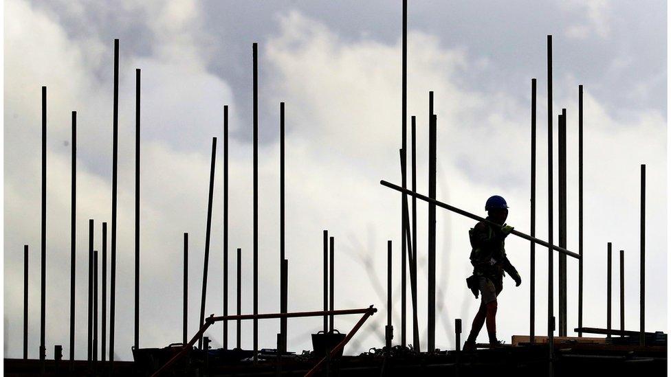 Construction worker building houses