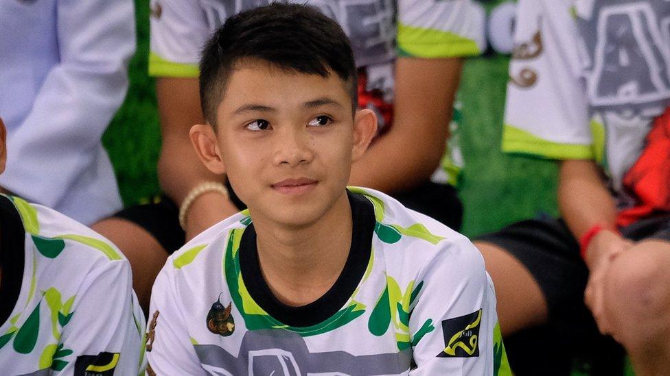 CHIANG RAI, THAILAND - JULY 18: Twelve boys from the "Wild Boars" soccer team and a Thai Navy SEAL (Right) speak during a press conference for the first time since they were rescued from a cave in northern Thailand last week, on July 18, 2018 in Chiang Rai, Thailand. The 12 boys, aged 11 to 16, and their 25-year-old coach were discharged early from Chiang Rai Prachanukroh hospital after a speedy recovery and thanked those involved in their rescue.