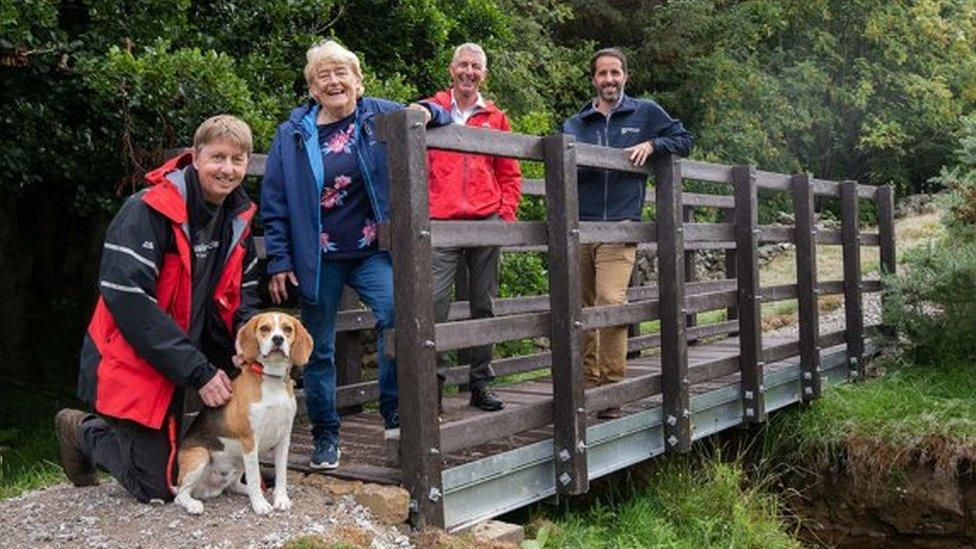 People standing on a bridge