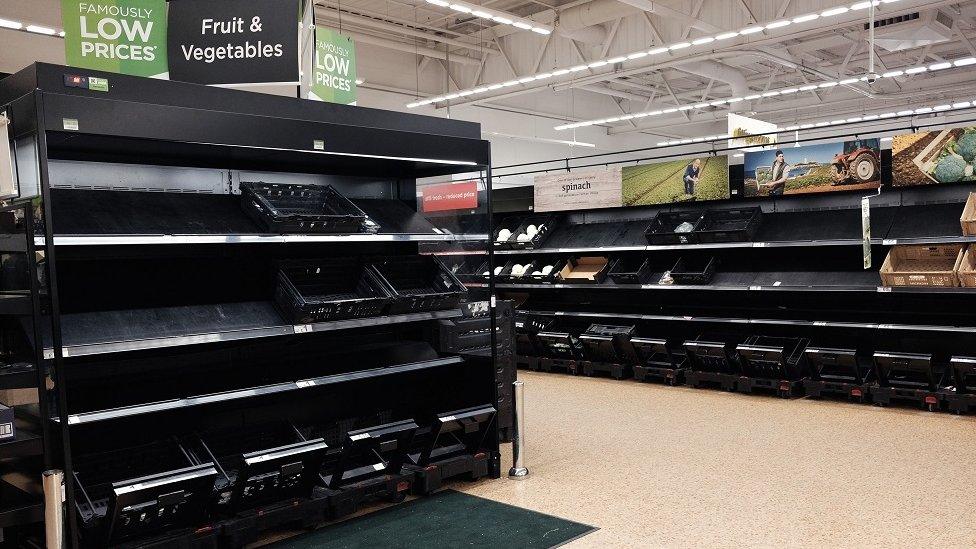 An empty fruit and vegetable aisle in an Asda supermarket