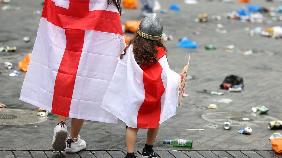 England fans are seen during the match outside Wembley Stadium