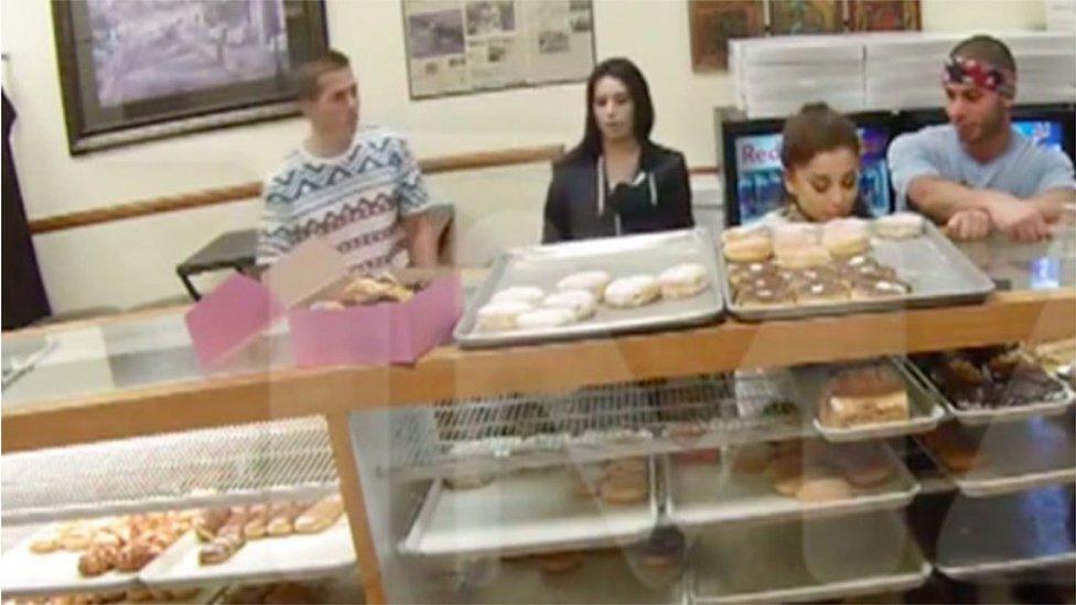 Ariana Grande licks a doughnut