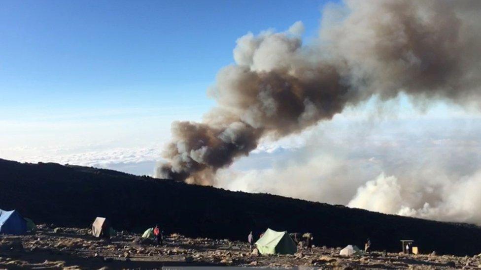 Plumes of smoke rise from a fire on the slopes of Mount Kilimanjaro on 22 October