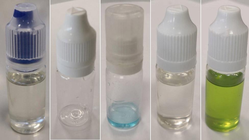 Small plastic bottles containing fake vaping liquid