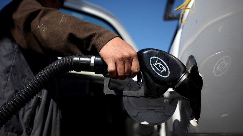 Man filling up car