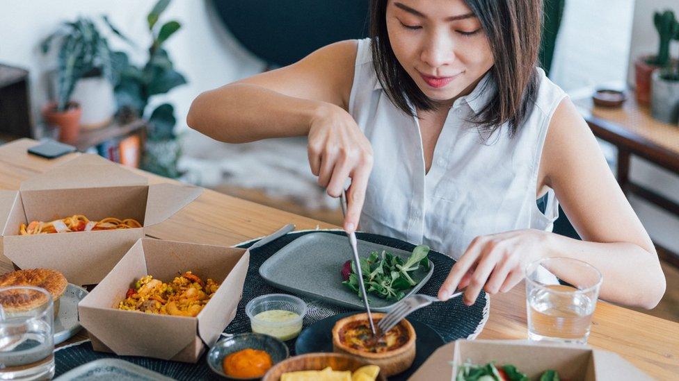 Woman eating takeaway food