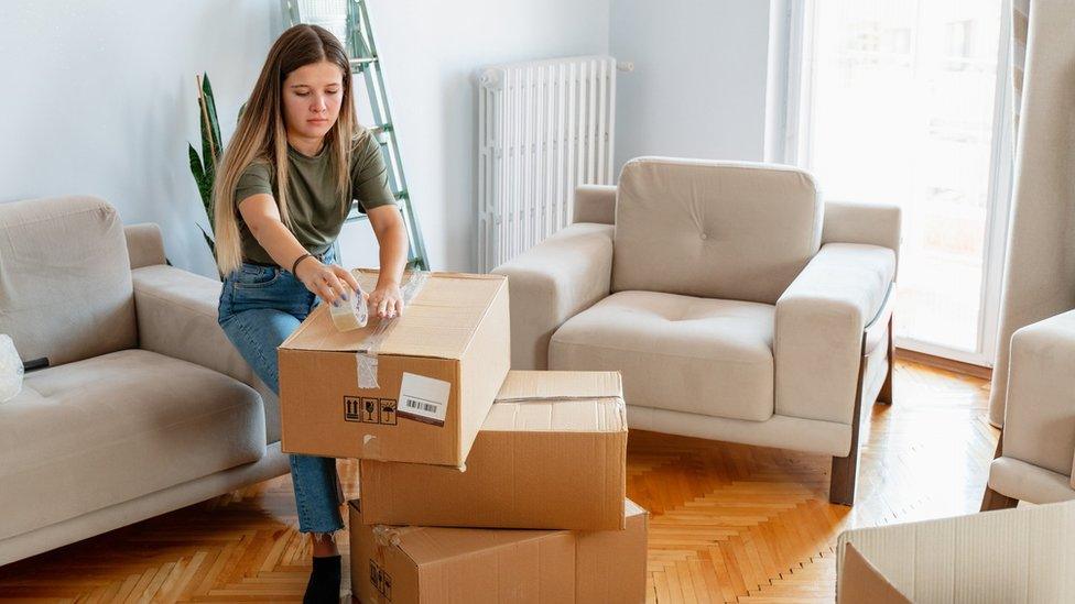 Woman unpacking boxes