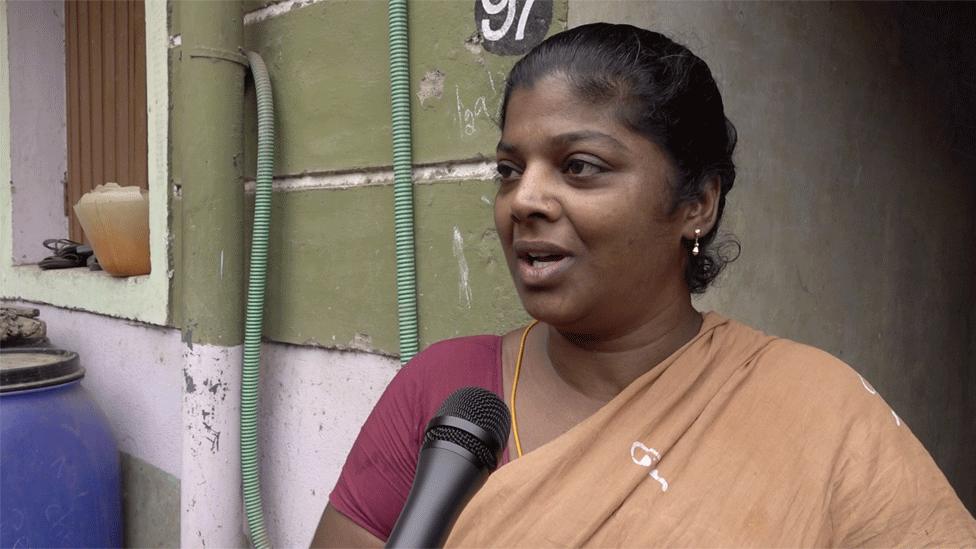 Saritha of fishermen colony, Thondiarpet in Chennai waits for water to be pumped up to her apartment