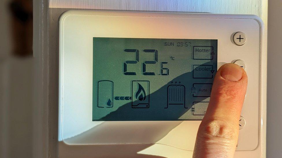 Finger turning down thermostat