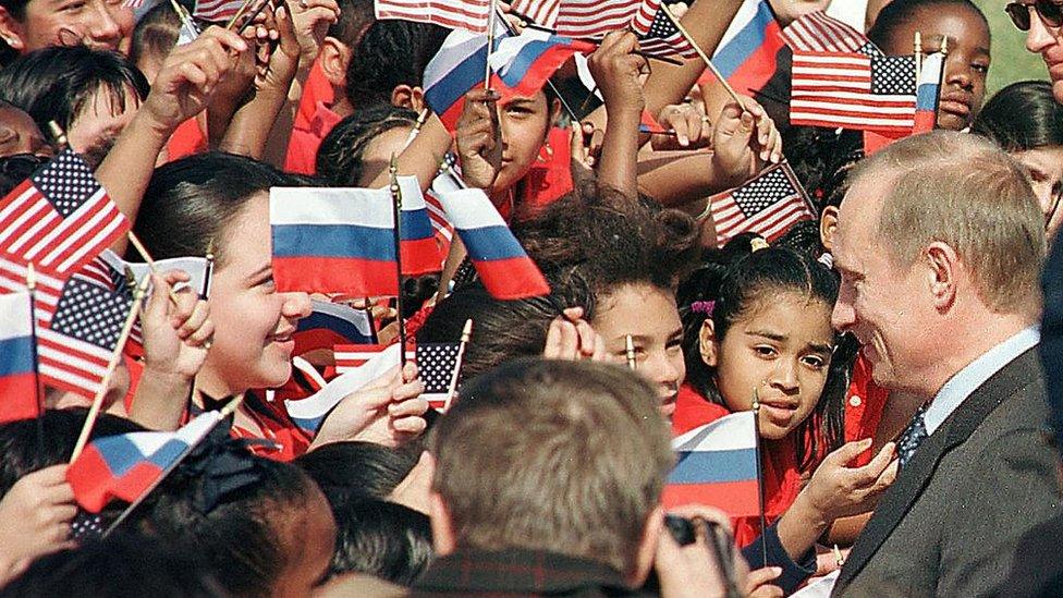 Mr Putin visits school children during his 2001 visit to the US