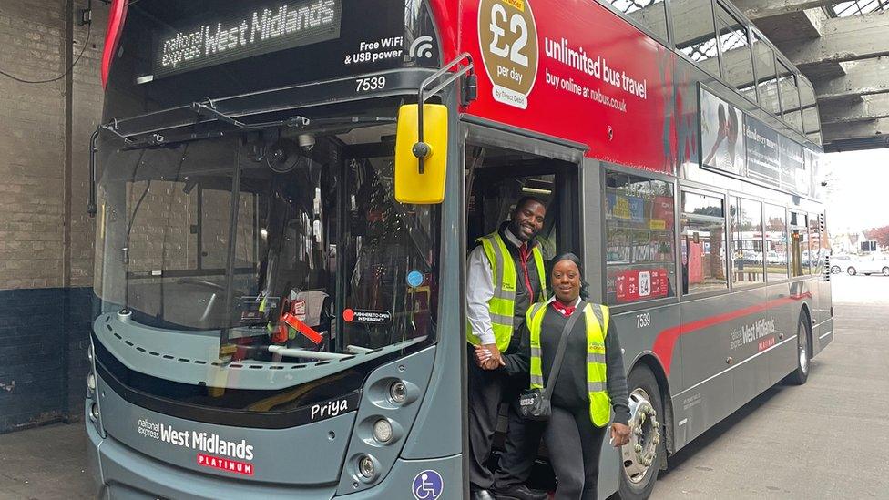 A couple on a National Express West Midlands bus