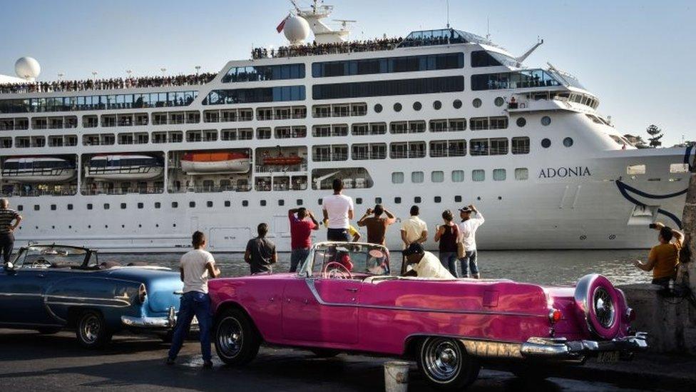 Cubans watch as the first US-to-Cuba cruise ship to arrive in the island nation in decades glides into the port of Havana, on May 2, 2016.