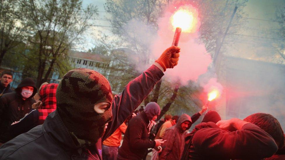 Pro-government supporters march during a protest on April 28, 2014 in Donetsk, Ukraine.