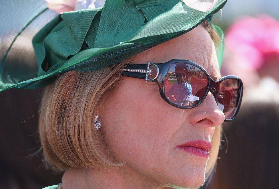 The reflection of Jockey Damien Oliver is seen in the sunglasses of trainer Gai Waterhouse during Melbourne Cup Day at Flemington Racecourse on November 3, 2015 in Melbourne