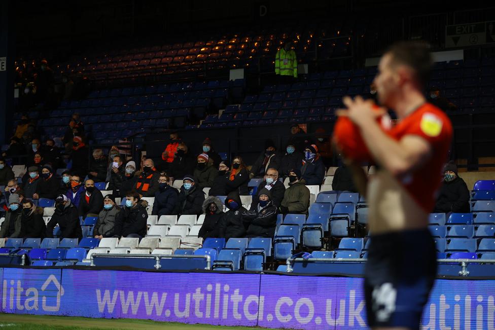 Fans look on from the stands during the match between Luton Town and Norwich City at Kenilworth Road