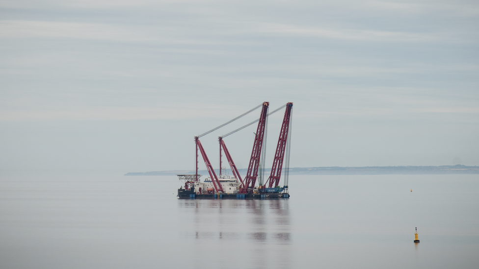 Floating crane platform in water