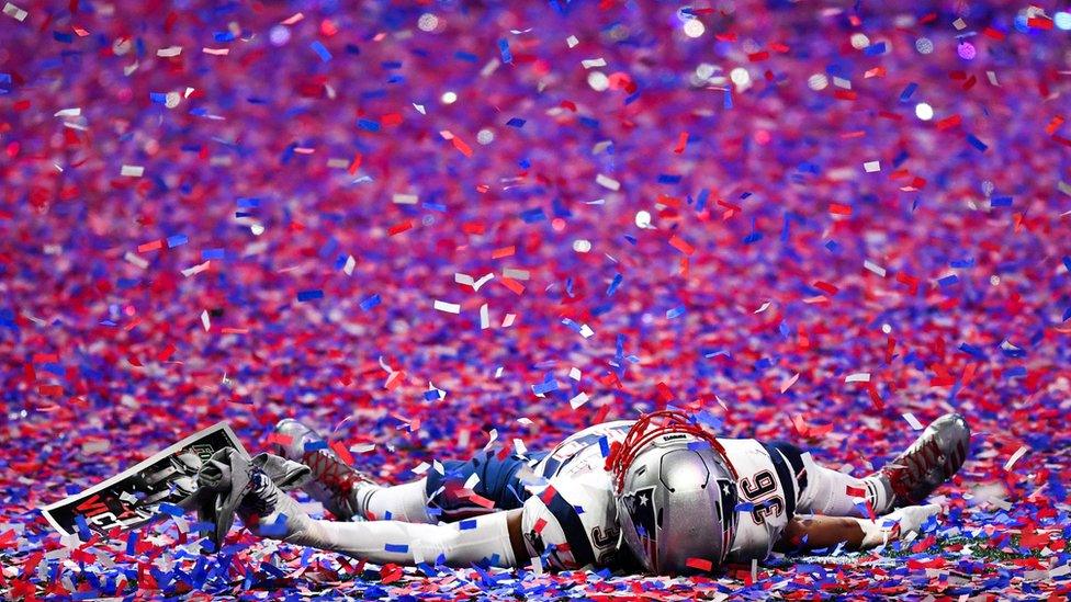 New England Patriots linebacker Brandon King (36) lays in the confetti after Super Bowl LIII