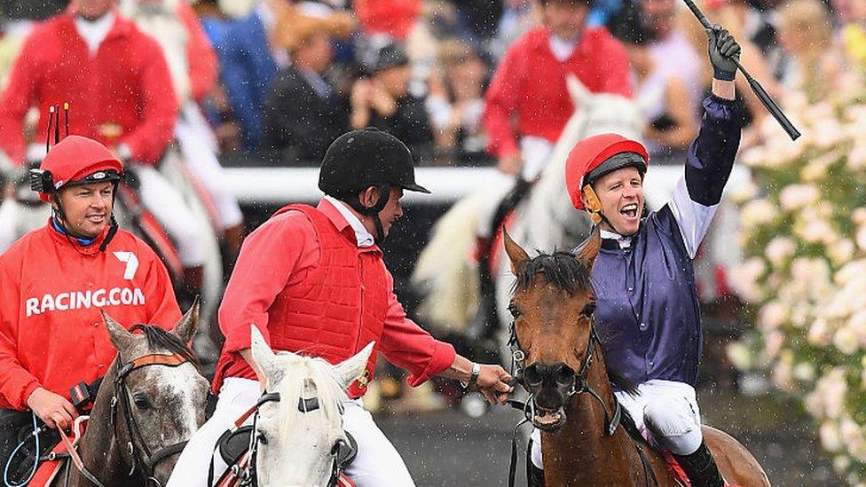 Kerrin McEvoy celebrates his Melbourne Cup victory aboard Almandin