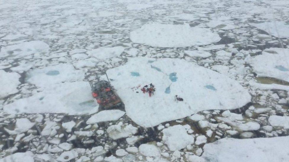 Cormorant helicopter from rescues 5 crew members from fishing vessel trapped in ice and taking on water