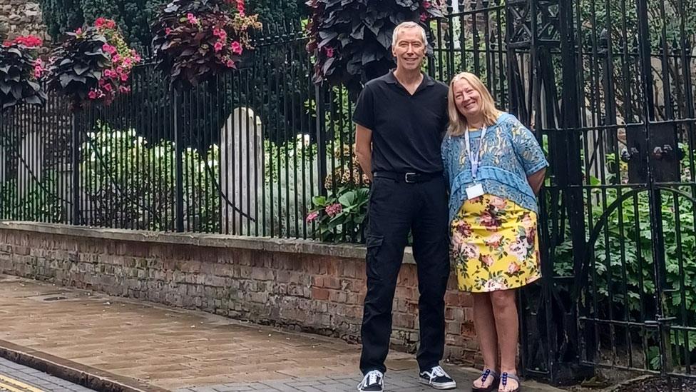 David King and Tracy Rudling in front of Holy Trinity Church