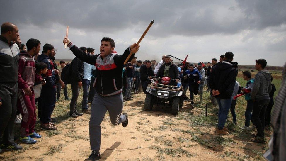 An injured protester is evacuated from Jabaliya