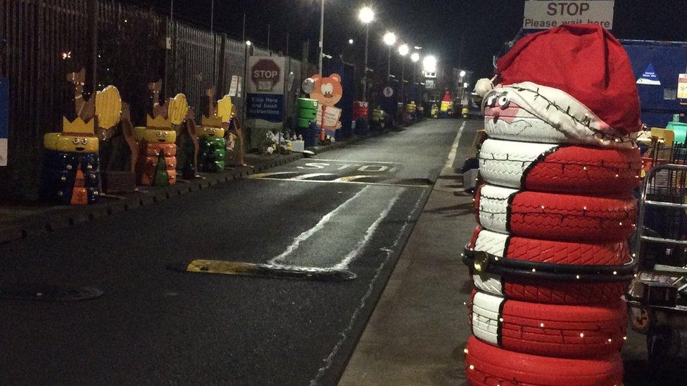 Old tyres stacked up and painted to look like Santa