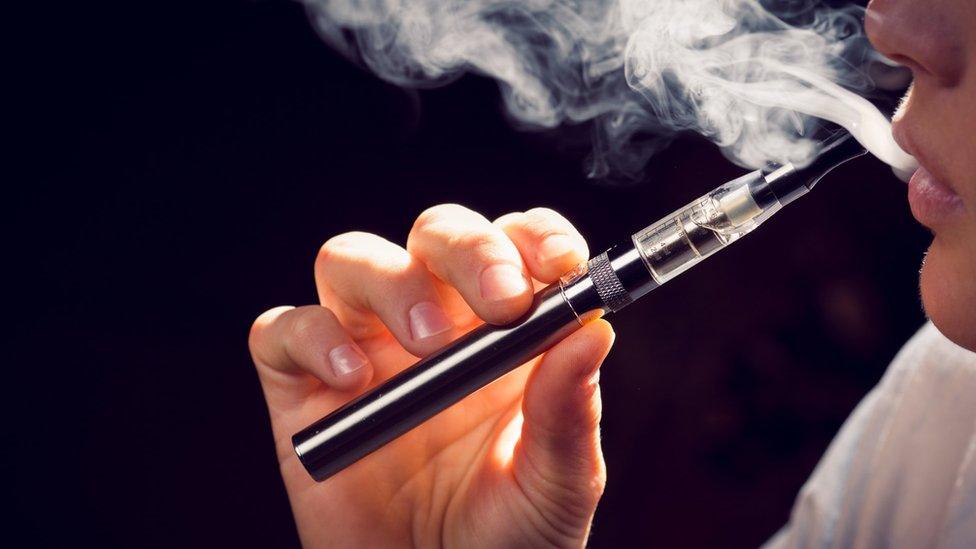 a person using an e-cigarette.