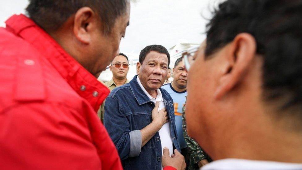 President Rodrigo Duterte is pictured with officials