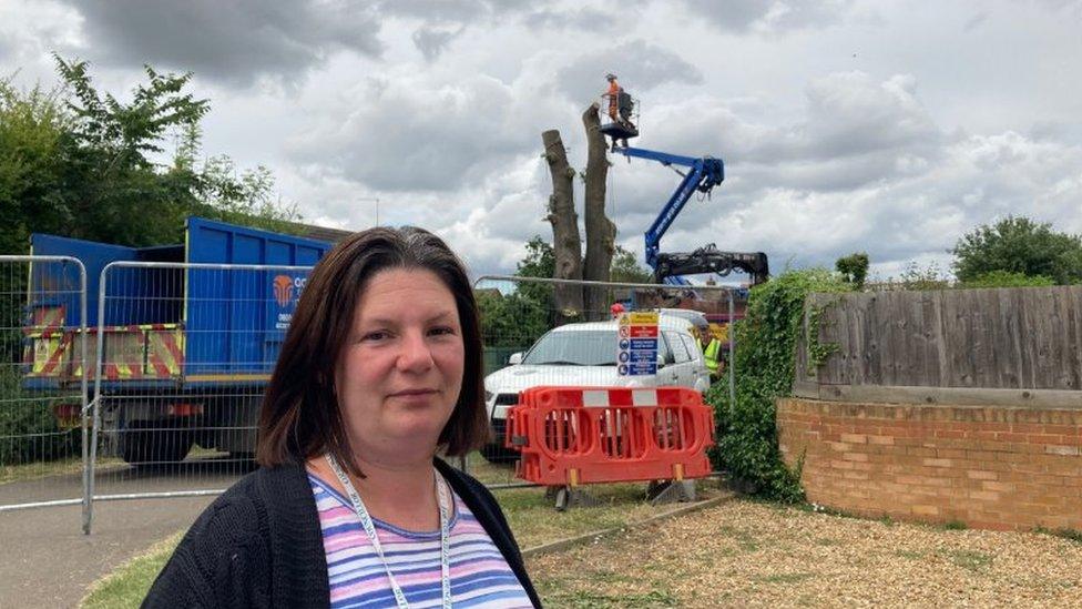 Kirsty Knight, green councillor, standing in front of tree-felling work